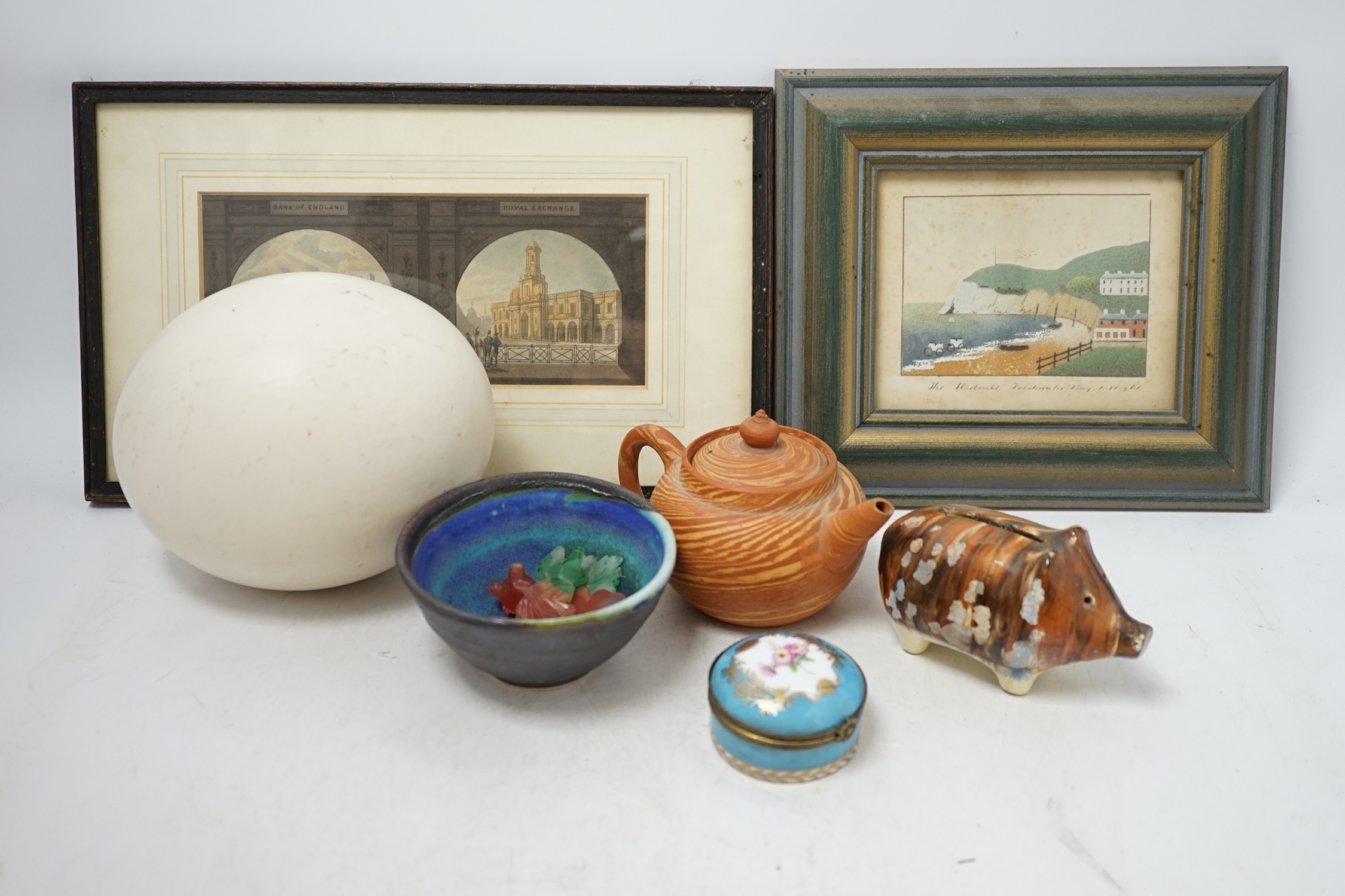 A collection of cabinet curiosities, including miniature cups, an ostrich egg, a Japanese marbled pottery teapot, a sand picture, snowmen cake decorations, etc. (2 trays). Condition - fair to good